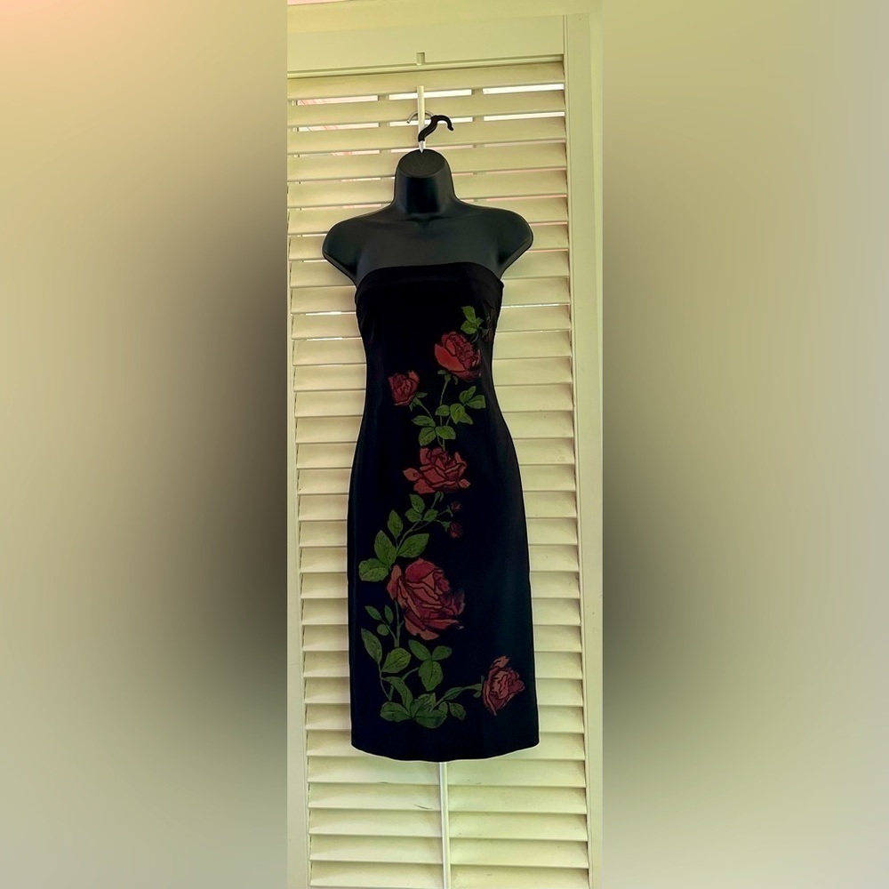 Elegant black strapless dress with red roses trim
